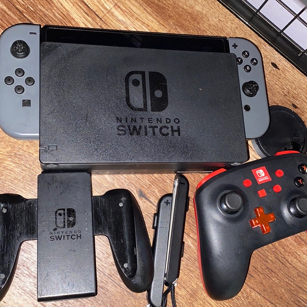 Grey Nintendo Switch with Black and Red controller